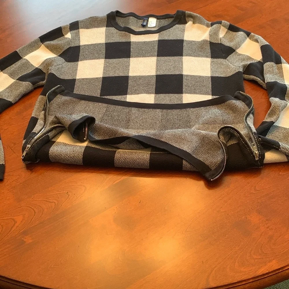 Divided Black and Cream Crewneck Sweater with Bold Check Pattern